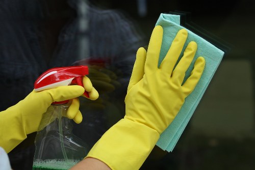 Professional carpets cleaner in Barnes deep cleaning a living room carpet