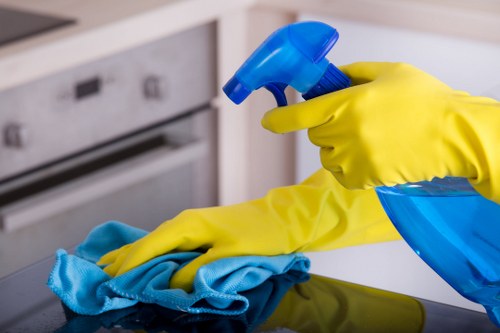 Local office cleaning team sanitising shared surfaces in Barnes